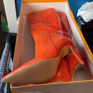 Orange high heel boots